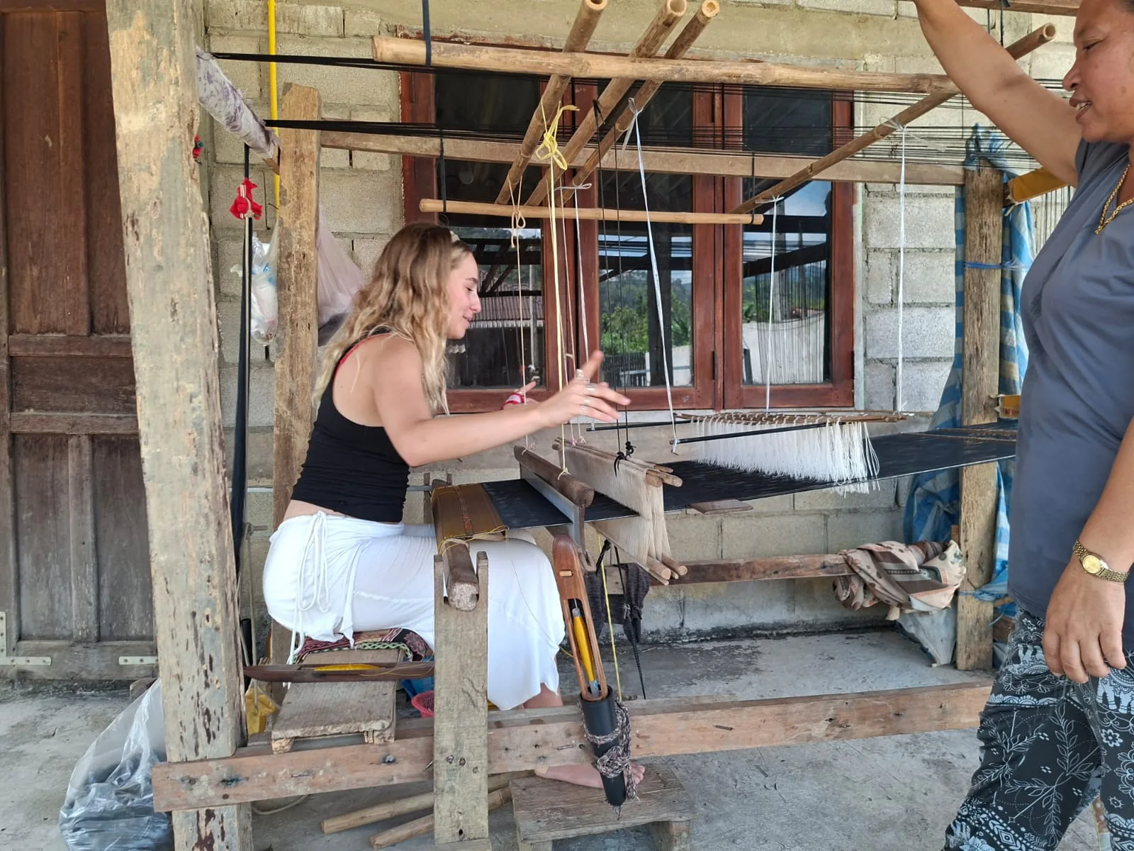Trying traditional weaving on a Khmu loom