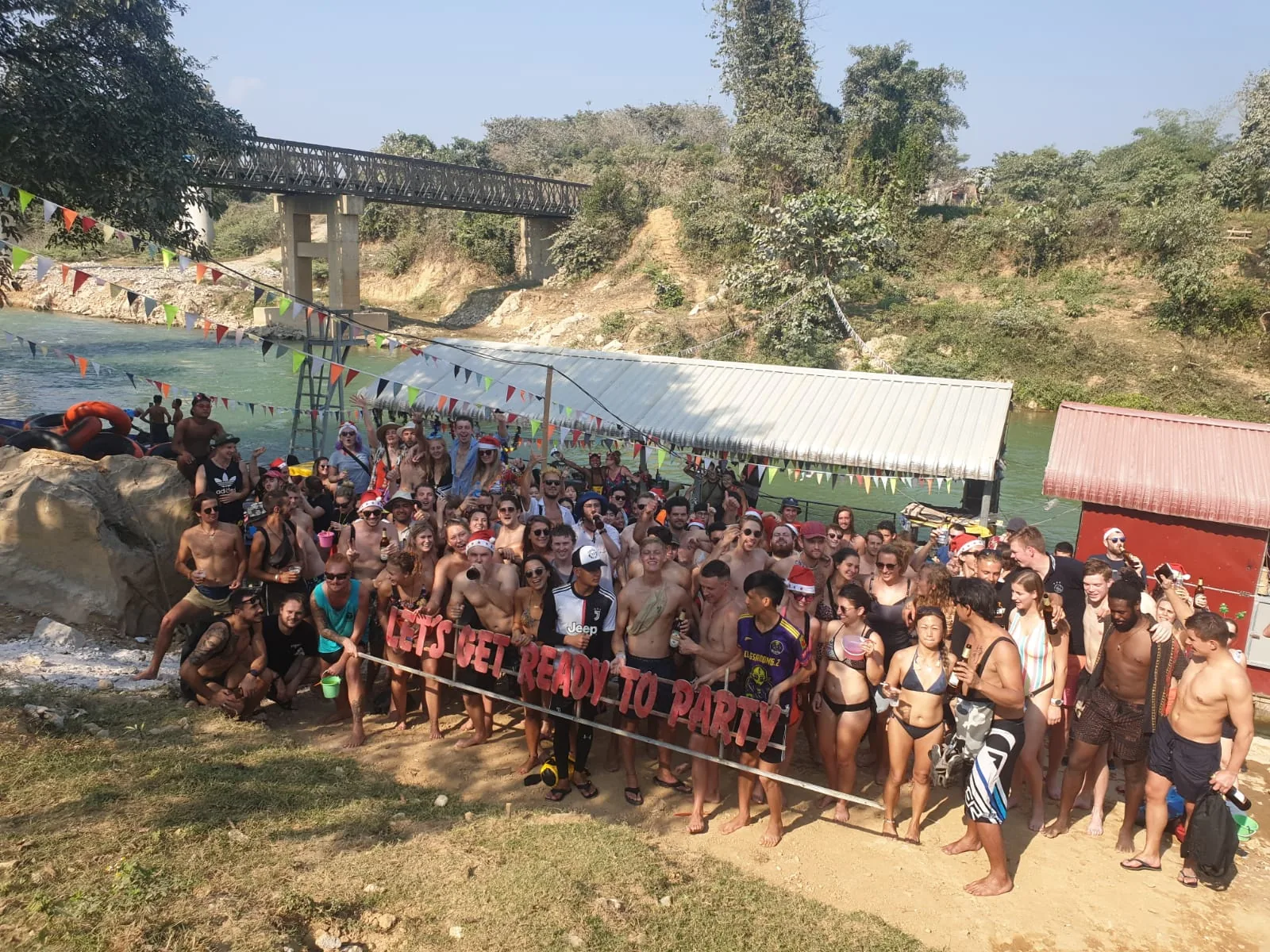 Group of travelers by the river in Vang Vieng