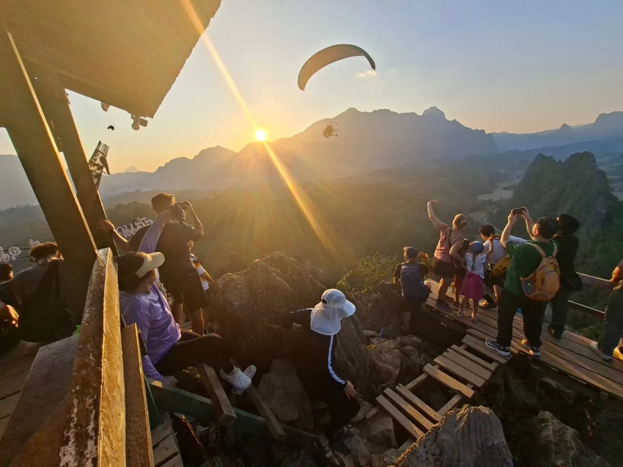 Sunset viewpoint over the mountains of Vang Vieng with a paramotor